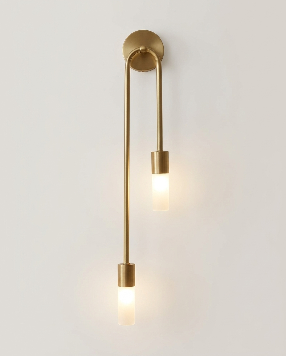Gold-finish double frosted glass wall sconce on a clean light neutral studio background