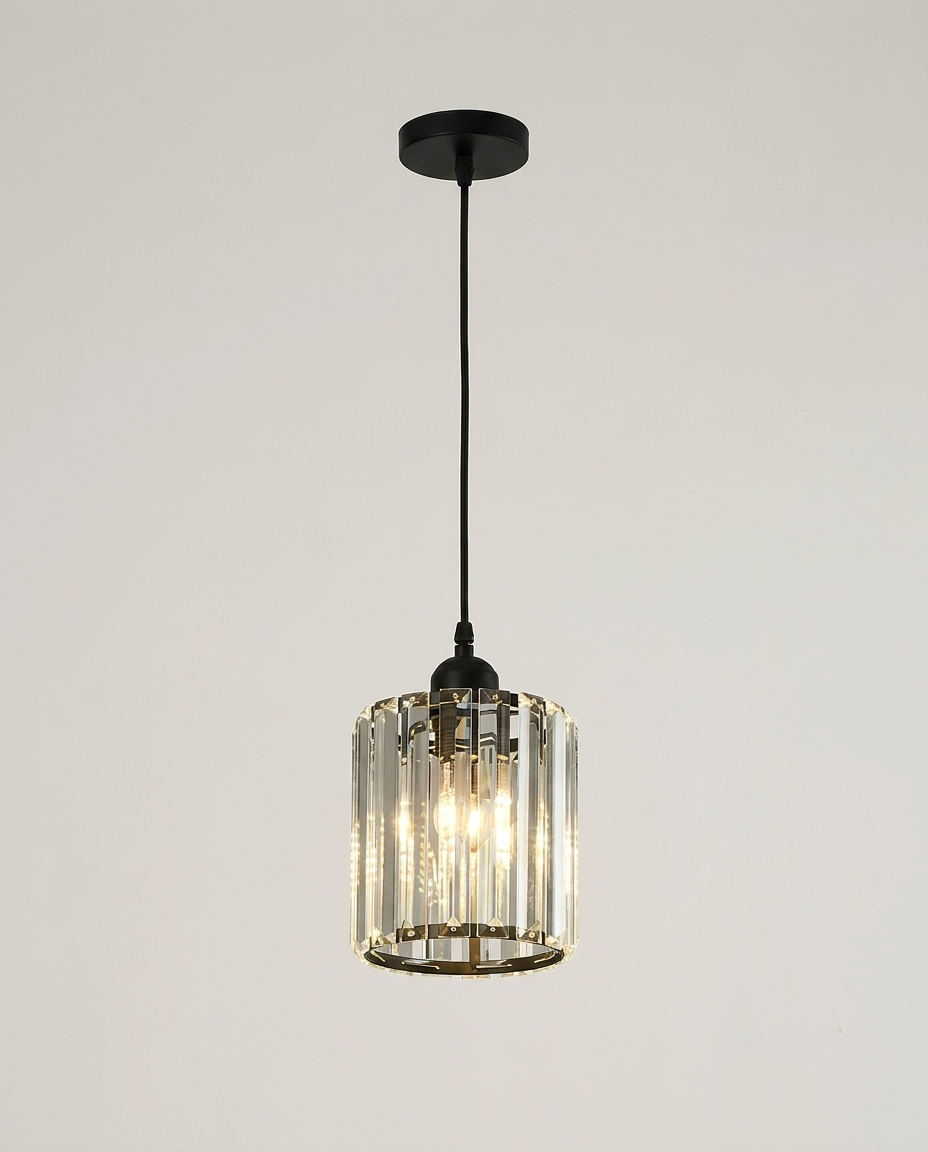Elegant K9 crystal pendant light on a clean light neutral studio background