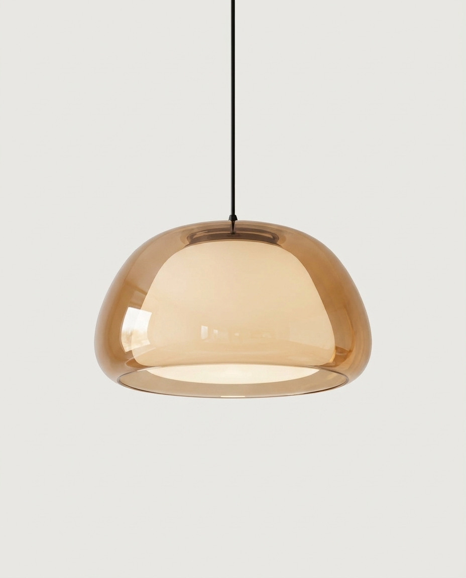 Contemporary glass dome pendant light isolated on a clean neutral studio background