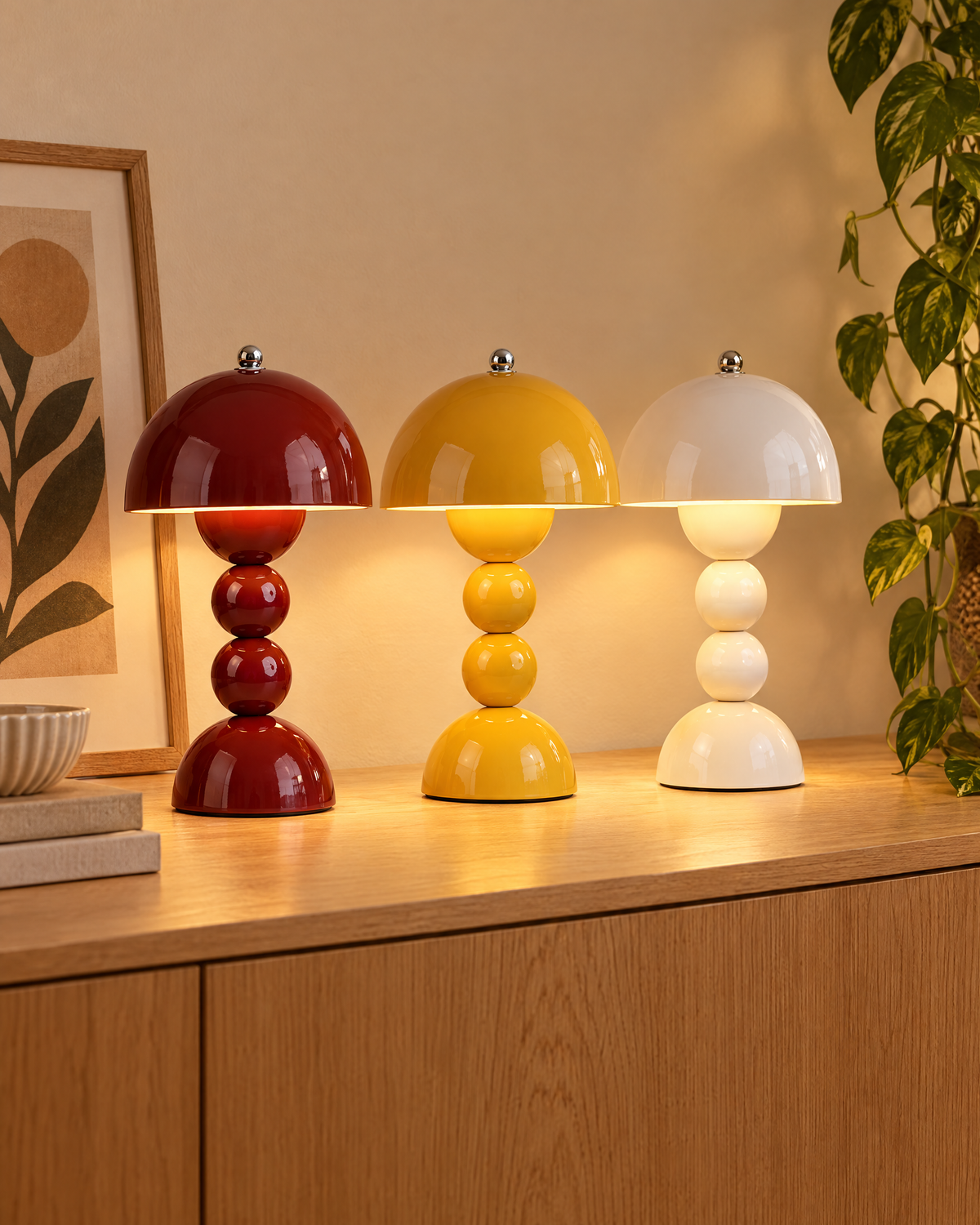 Burgundy, mustard and white bubble mushroom table lamps on an oak console