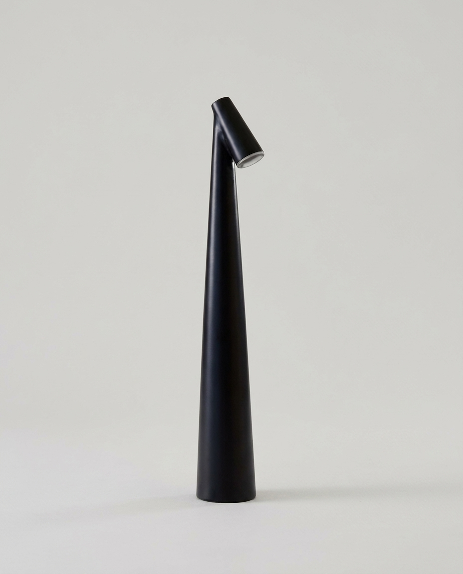 Nordic minimalist wireless LED table lamp on a clean light neutral studio background