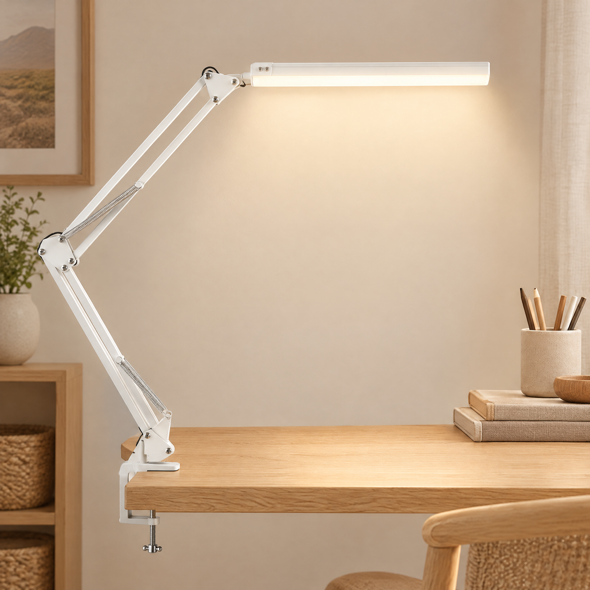 White swing arm LED desk lamp on a plain background