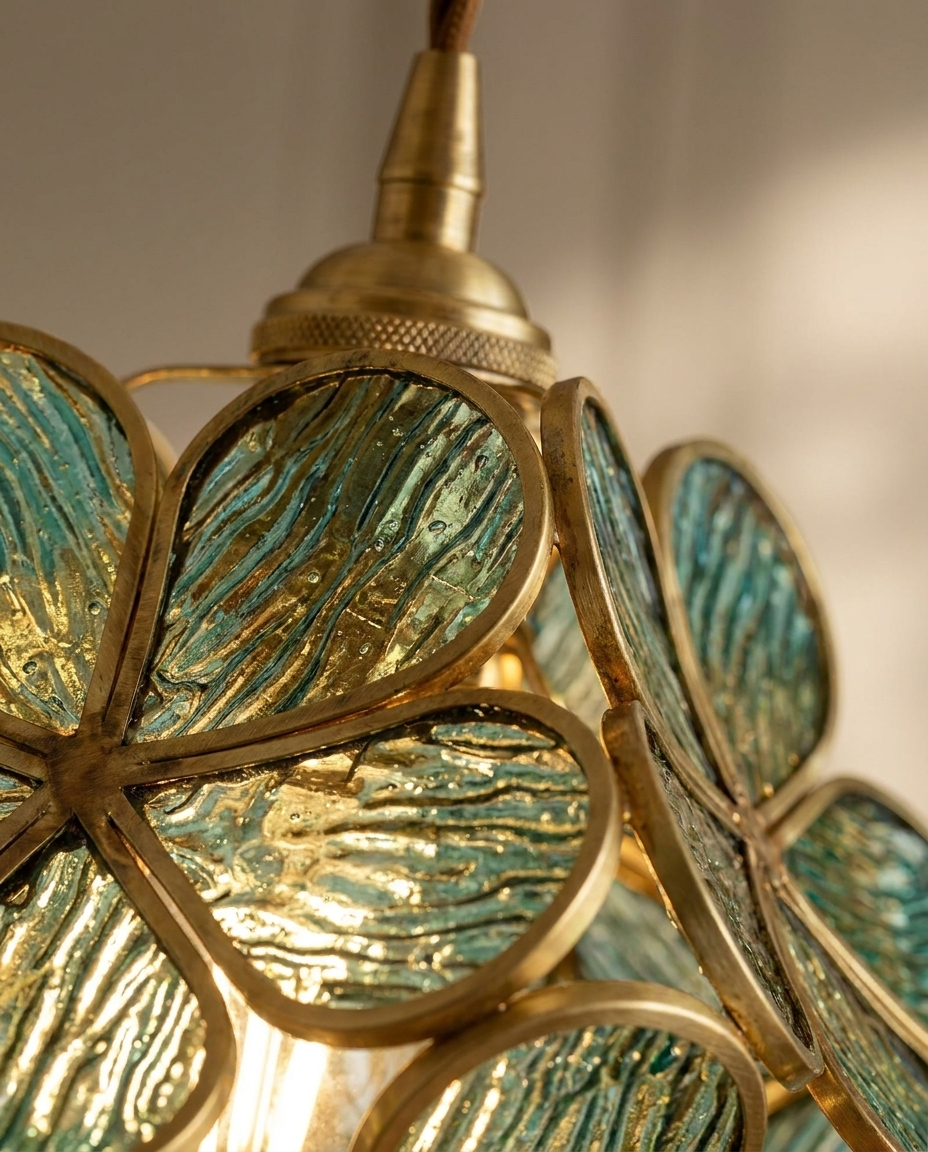 Close-up of vintage brass finish and glass flower petal texture