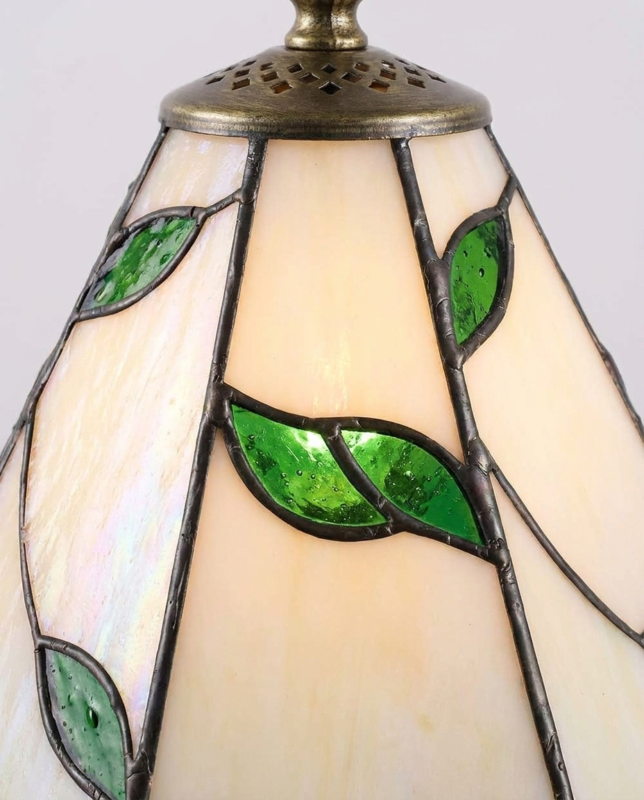 Close-up of colorful stained Tiffany glass pattern on a retro table lamp shade