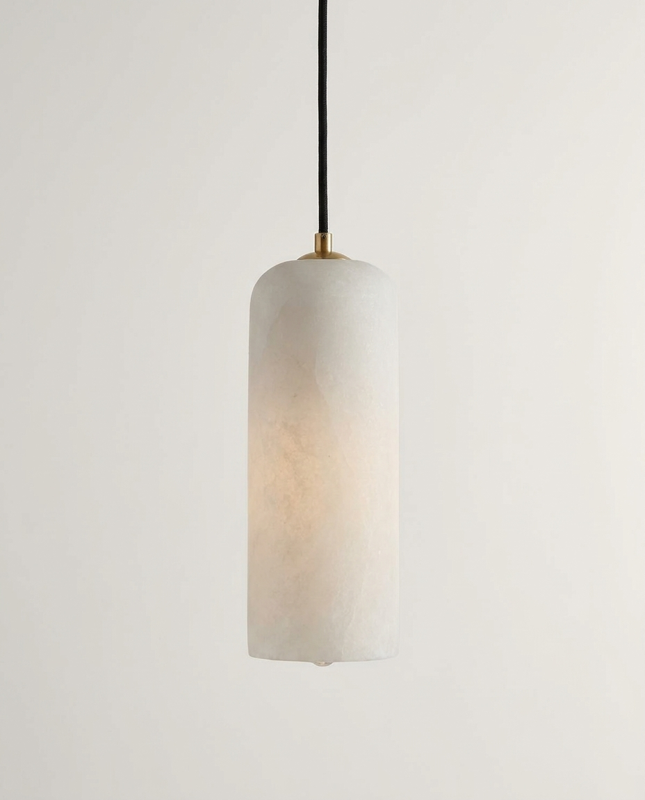 Alabaster globe pendant light isolated on a clean neutral studio background