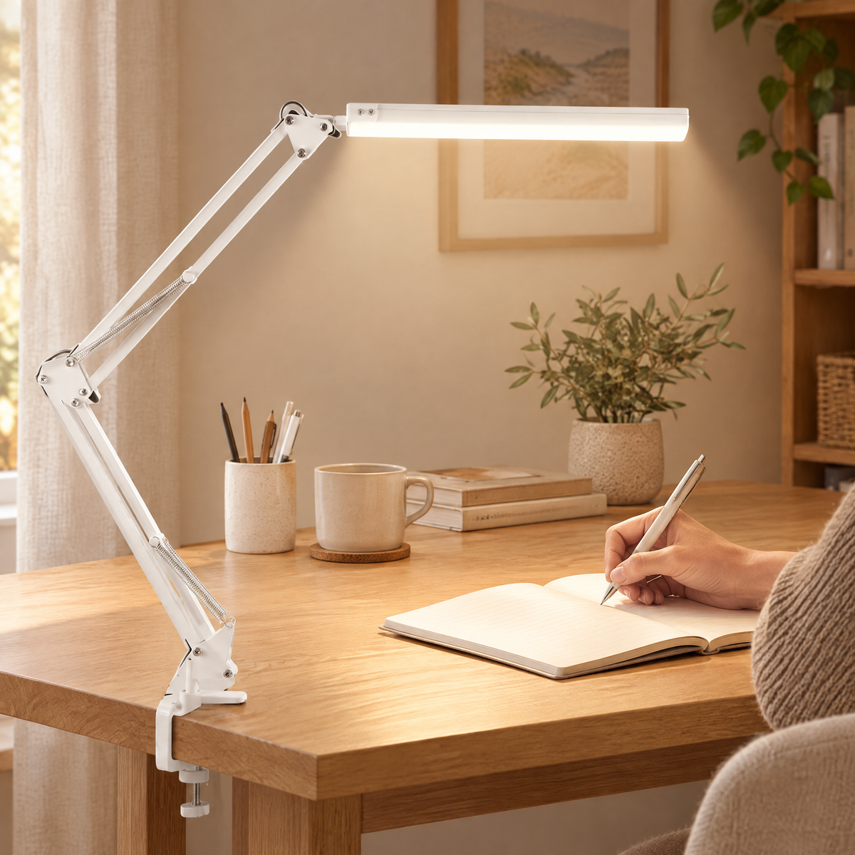 White swing arm LED desk lamp in use