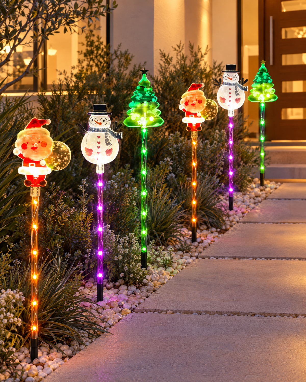 Solar Christmas stake lights lining a front garden path